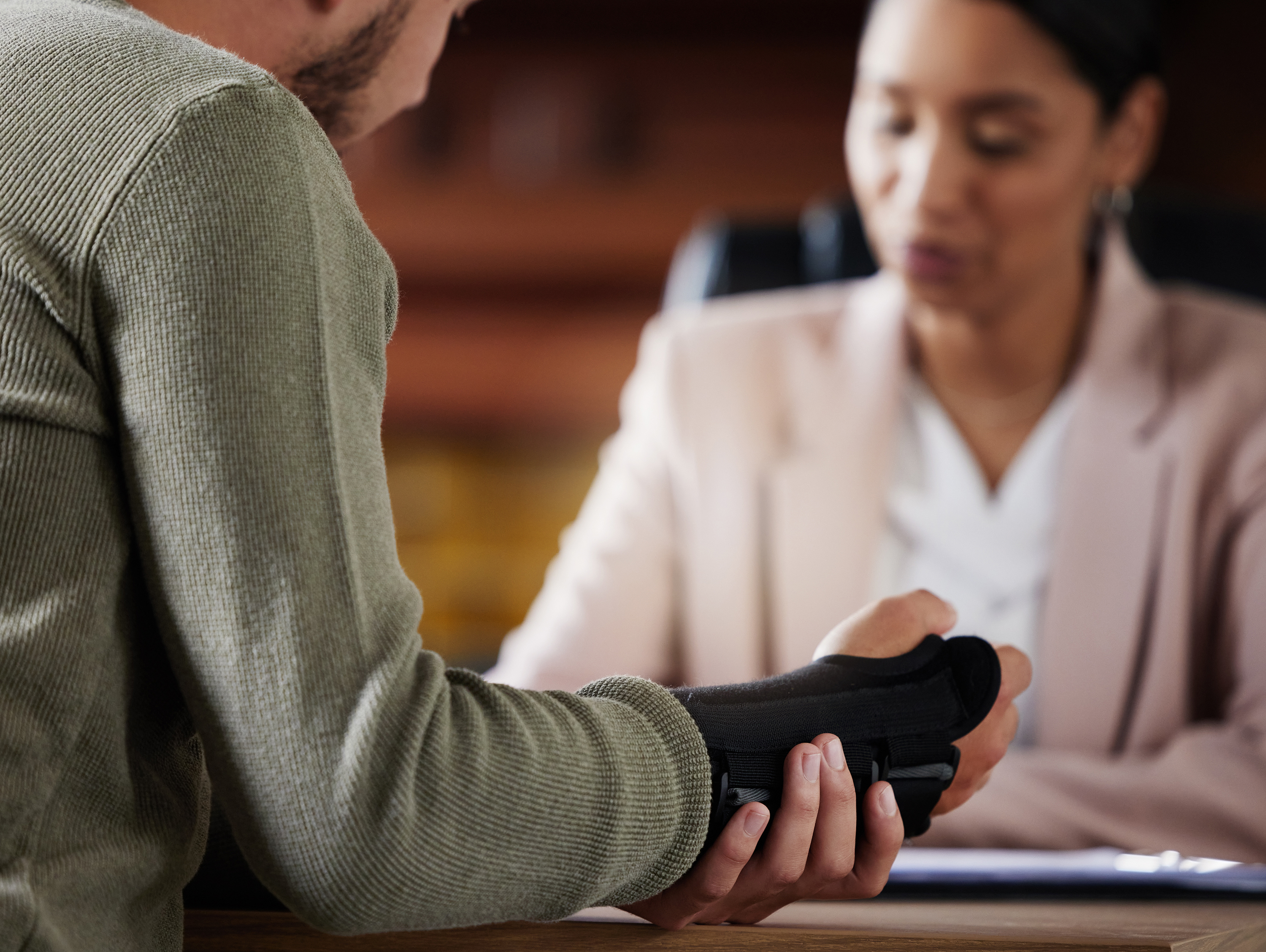 Man with Arm Brace Talking with Woman