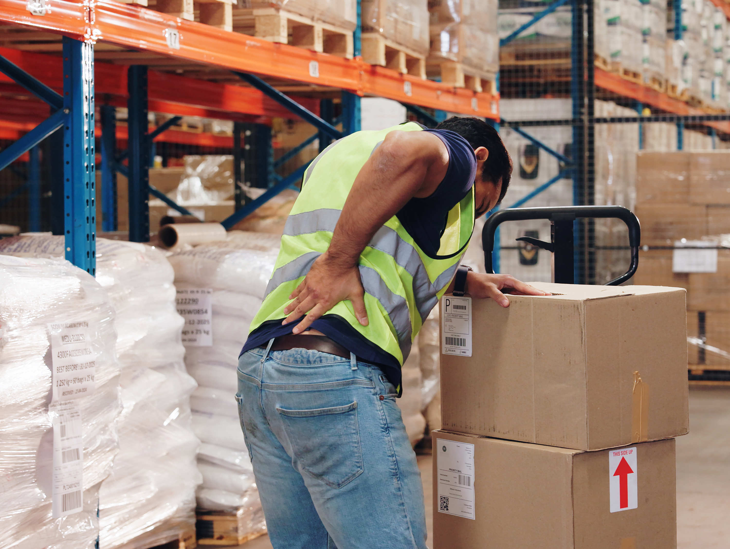 Warehouse Worker Holding Back