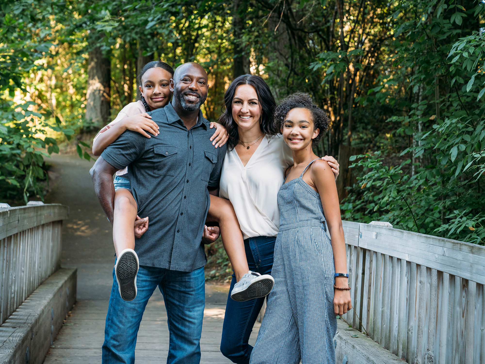 Family Standing on Walking Bridge